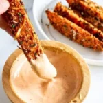 Baked garlic parmesan sweet potato wedges served on a plate