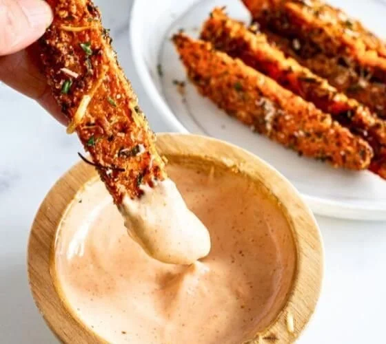 Baked garlic parmesan sweet potato wedges served on a plate