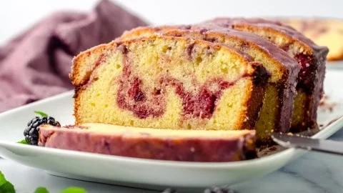 Delicious blackberry pound cake with fresh blackberries on a plate