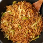 Plate of delicious homemade Chow Mein with fresh vegetables and noodles.