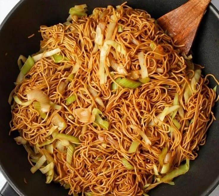 Plate of delicious homemade Chow Mein with fresh vegetables and noodles.