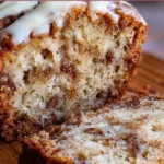 Delicious cinnamon roll banana bread ready to be served on a plate.