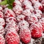 Delicious easy chocolate raspberry tart topped with fresh raspberries