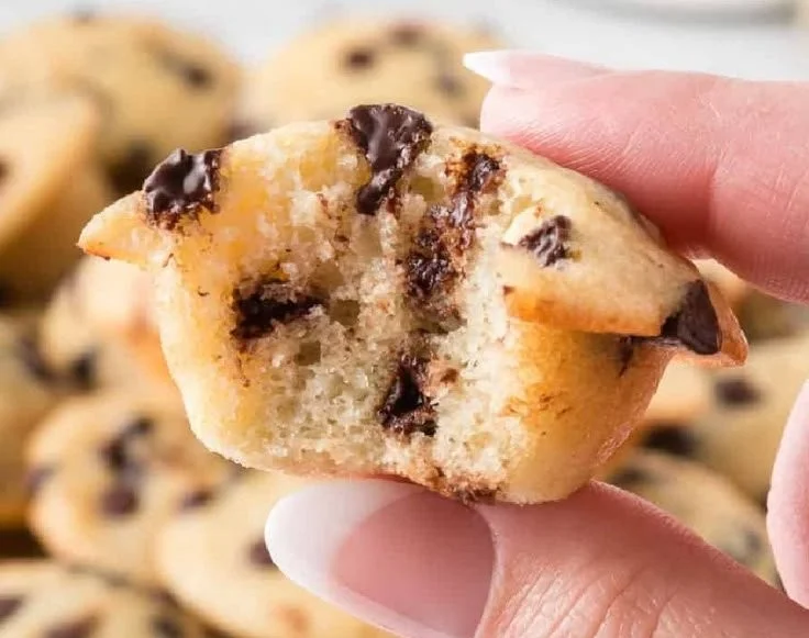 Mini chocolate chip muffins fresh out of the oven, ready to be enjoyed.