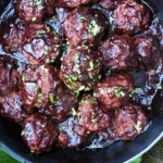 Delicious homemade blackberry barbecue sauce in a jar with fresh blackberries.