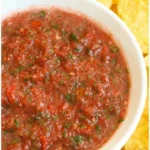 Freshly made blender salsa in a bowl with vibrant colors and fresh ingredients