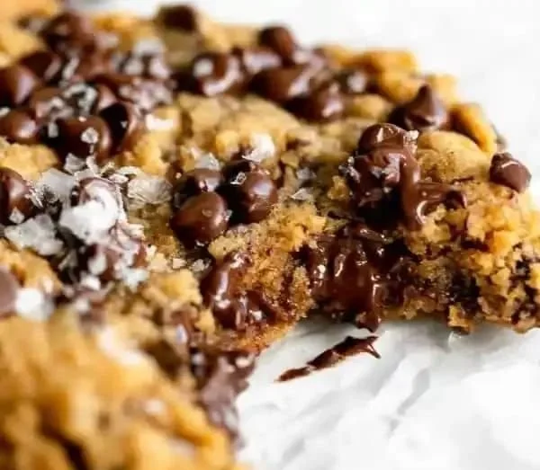 Gluten free peanut butter chocolate chip cookies on a baking tray