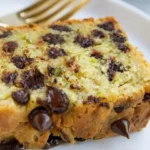Easy gluten-free zucchini bread sliced on a wooden board