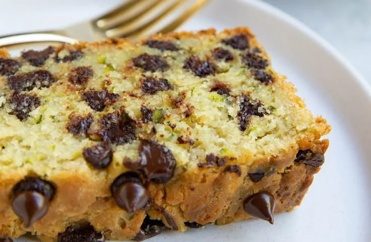 Easy gluten-free zucchini bread sliced on a wooden board