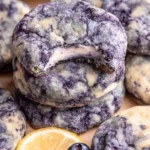 Lemon blueberry cheesecake cookies on a plate, showcasing their delicious texture and colors.