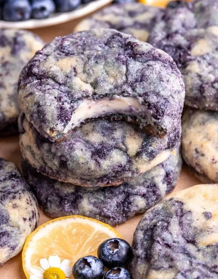 Lemon blueberry cheesecake cookies on a plate, showcasing their delicious texture and colors.