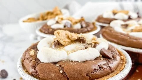 Mini S'mores Pies with chocolate and marshmallow filling in a crispy crust