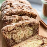 Moist cinnamon swirl zucchini bread slice with swirls of cinnamon and zucchini