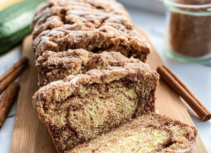 Moist cinnamon swirl zucchini bread slice with swirls of cinnamon and zucchini
