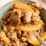Delicious old-fashioned peach crisp dessert with crunchy topping and fresh peaches