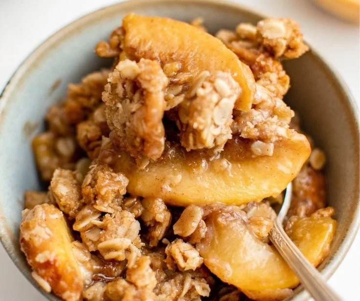 Delicious old-fashioned peach crisp dessert with crunchy topping and fresh peaches