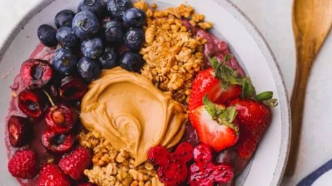 Delicious Peanut Butter Acai Bowl topped with fresh fruits and granola