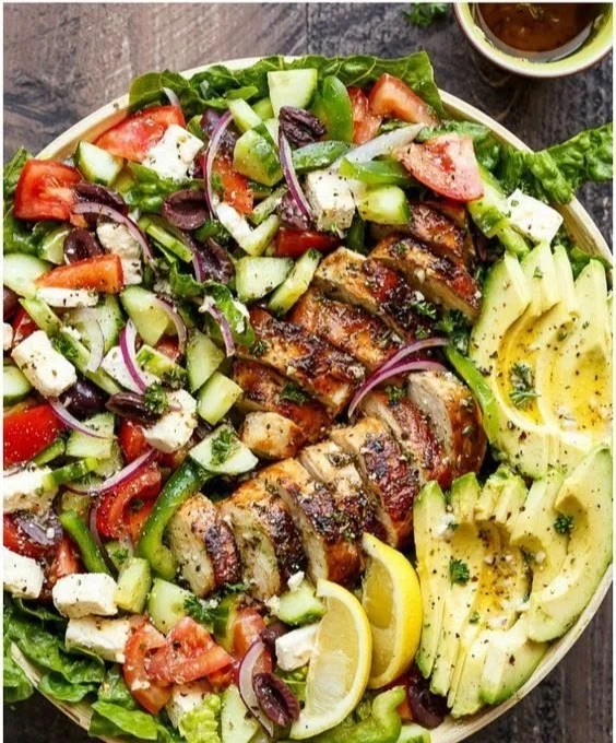 A variety of healthy dinner options including salads, grilled chicken, and vegetables.