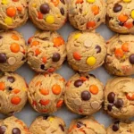 Delicious Reese's Pieces Peanut Butter Cookies on a cooling rack