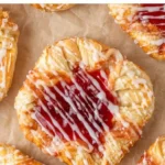 Freshly baked Strawberry Cream Cheese Danishes on a plate.