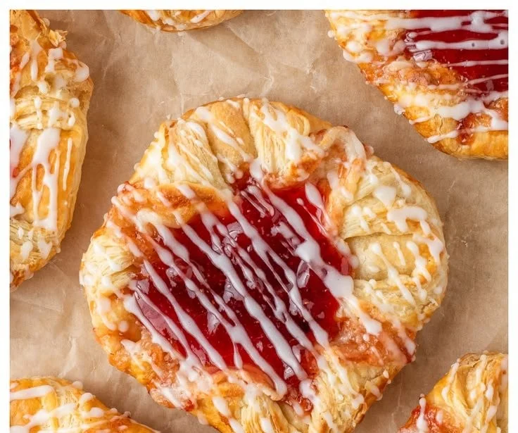 Delicious homemade Strawberry Cream Cheese Danishes on a plate.