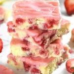 Freshly baked Strawberry Lemon Blondies on a white plate