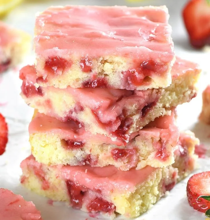 Freshly baked Strawberry Lemon Blondies on a white plate