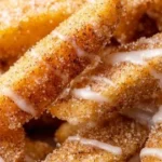 Air fryer apple fries served in a bowl, crispy and delicious snack.
