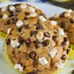 Delicious Banana S'mores Muffins topped with chocolate and graham crackers