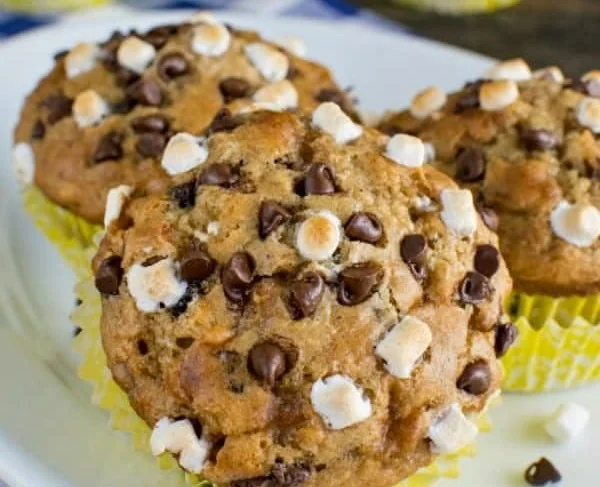 Delicious Banana S'mores Muffins topped with chocolate and graham crackers