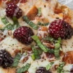 Blackberry Basil Bacon Grilled Pizza recipe on a wooden board