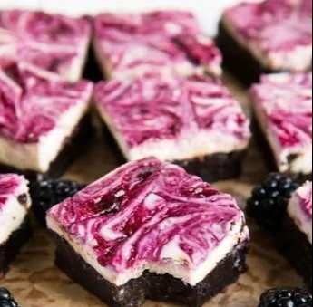 Delicious homemade blackberry cheesecake brownies with creamy cheesecake layer