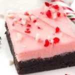 Delicious candy cane brownies topped with crushed candy canes for a festive treat.