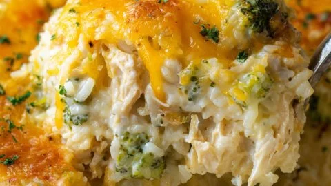 Cheesy broccoli chicken casserole baked with rice and topped with melted cheese.