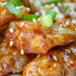 Delicious Chinese Honey Garlic Chicken served with vegetables on a plate.