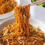 Delicious classic Chinese Chow Mein served in a bowl with vegetables and noodles.