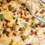 Delicious Crack Chicken served on a plate with herbs and spices.
