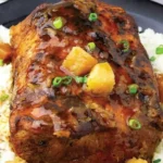 Crock Pot pork loin with pineapple served on a plate