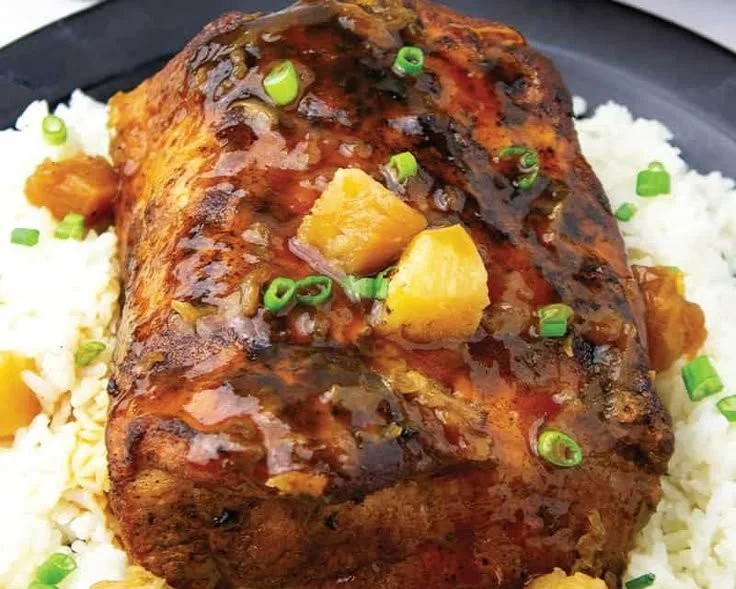 Crock Pot pork loin with pineapple served on a plate