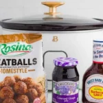 Crockpot BBQ grape jelly meatballs served in a bowl with toothpicks