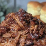 Delicious Dr Pepper pulled pork served with BBQ sauce and coleslaw