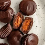 Delicious chocolate pumpkin butter cups served on a decorative plate