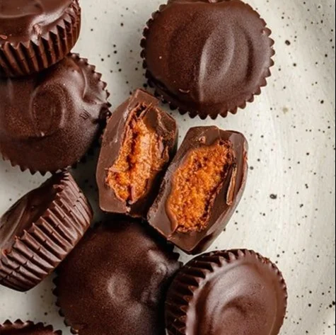Delicious chocolate pumpkin butter cups served on a decorative plate