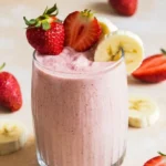 Delicious strawberry banana smoothie with fresh fruits and yogurt