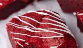 Fudgy red velvet brownies topped with cream cheese frosting