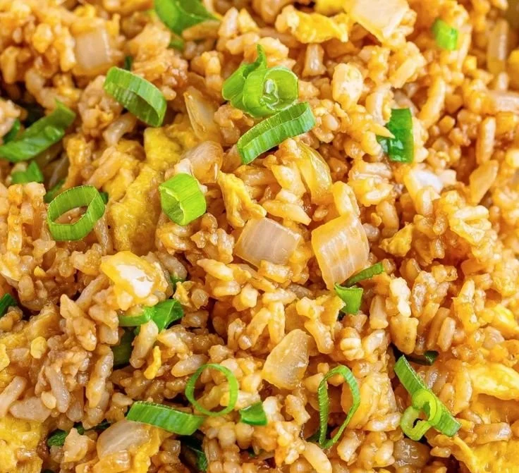 A plate of homemade Hibachi Fried Rice with vegetables and shrimp