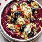 Homemade acai bowl topped with fruits and granola for a healthy breakfast