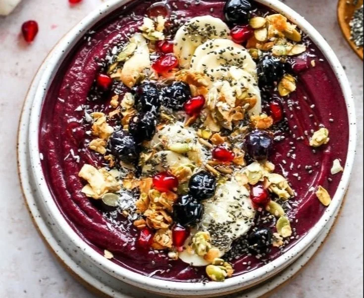 Homemade acai bowl topped with fruits and granola for a healthy breakfast