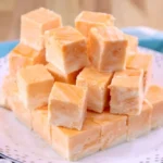 Delicious homemade orange cream fudge on a plate