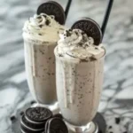 Delicious Oreo Milkshake topped with whipped cream and crushed Oreos